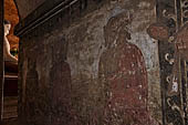 Bagan Myanmar. Dhammayangyi temple. Mural painting of the walls representing Buddha. 